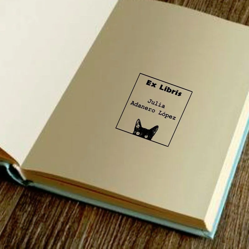 Cat looking book stamp